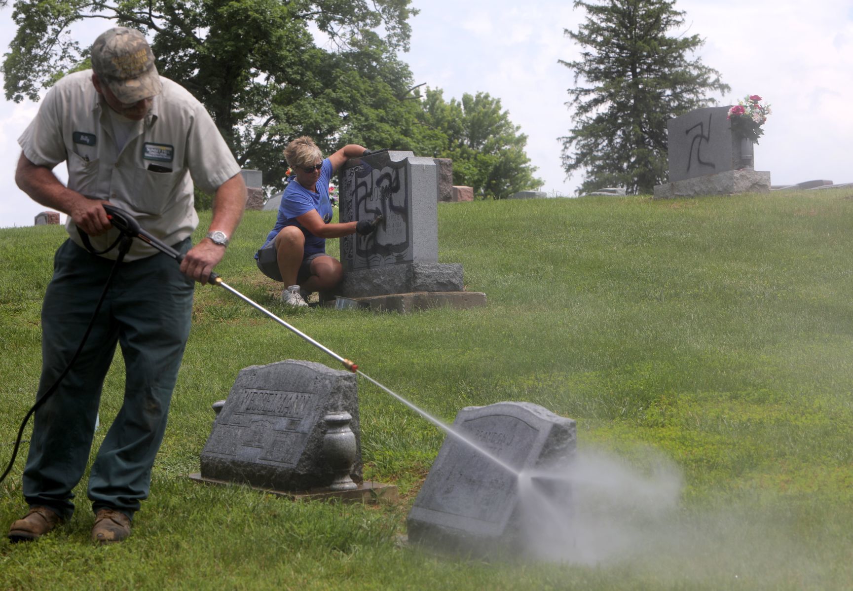 Vandal spray-paints swastikas 150 to 200 headstones and markers